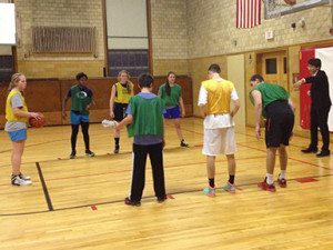 Regan Sun '14, serving as a referee during basketball practice.  